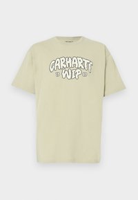 Ανοιχτό πράσινο βαμβακερό t-shirt με φαρδιά γραμμή, με μαύρο, σύννεφο-στυλ τύπωμα "Carhartt WIP 1989" μπροστά. Κοντά μανίκια, στρογγυλή λαιμόκοψη.