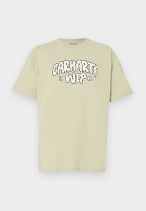 T-shirt en coton vert clair avec coupe oversize, présentant un imprimé noir de style nuage "Carhartt WIP 1989" sur le devant. Manches courtes, col rond.