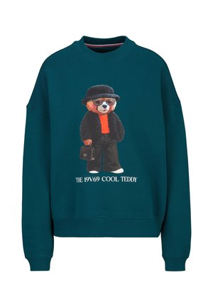 Donker turquoise sweatshirt met een cartoonbeer die een bril, een zwarte hoed en jas draagt, oranje overhemd, houdt een zwarte tas vast, tekst "THE 19V69 COOL TEDDY".