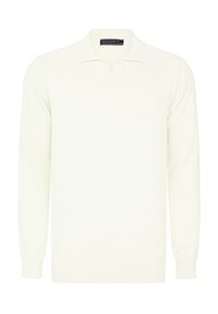 Ljusbeige långärmad polo med ribbad krage och muddar, tillverkad av ett mjukt, strukturerat tyg, med en plats för tre knappar.