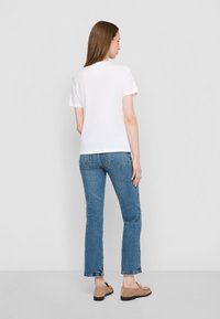 Tommy Hilfiger LOGO - Print T-shirt - optic white