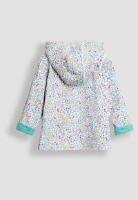 Giacca leggera con un motivo floreale in rosa, giallo e blu su sfondo bianco. Presenta un cappuccio e polsini color teal.
