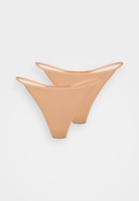 Nude thong underwear with thin straps, featuring a smooth texture and minimalist design. Made from soft, stretchy fabric for comfort.