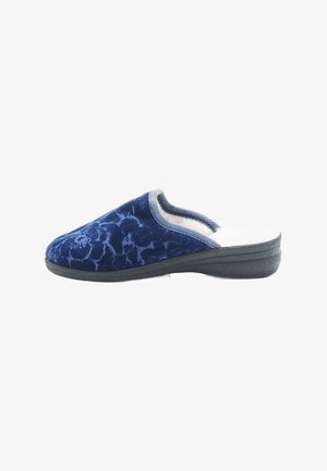 Zapato de terciopelo azul marino tipo slip-on con patrón floral, parte superior texturizada, forro suave y suela de goma negra para mayor estabilidad.