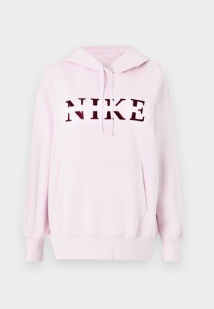 Ružová mikina s klokanie kapsou a sťahovacou kapucňou. Na prednej strane sa nachádza veľké, tmavočervené logo "NIKE". Mäkká textúra látky.