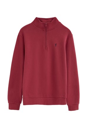 Pull-over en polaire rouge avec fermeture quart zip, manches longues et petit logo brodé noir représentant un golfeur sur le côté gauche de la poitrine.