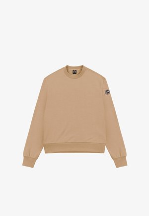 Sudadera beige con mangas largas, escote redondo y puños acanalados. Presenta un parche con logo en la manga izquierda. Tela de textura suave y lisa.