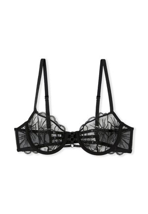 Soutien-gorge en dentelle noire avec un motif floral transparent, des bords festonnés et des bretelles réglables. Dispose d'une fermeture à crochet et œillet au dos.