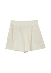 Shorts pour femmes de couleur crème avec une taille élastique et des broderies florales près de l'ourlet sur les deux jambes.