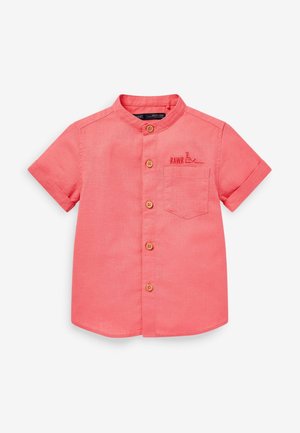 Chemise corail à manches courtes avec col mandarin, poche poitrine, boutons en bois et texte "RAWR" avec broderie de dinosaure.