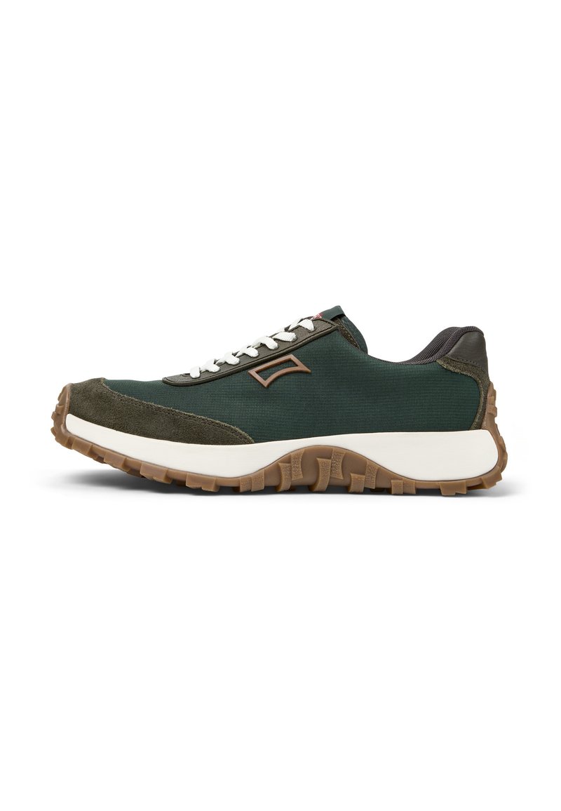 Dark green athletic shoe with a fabric and suede upper, white laces, brown accents, and a textured rubber sole. Side profile view.