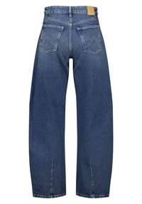 Farkut keskipitkässä sinisessä sävyssä, löysällä istuvuudella, joissa on kaksi takataskua, brändilogo ja huomaamattomat sivuhalkiot helmassa.