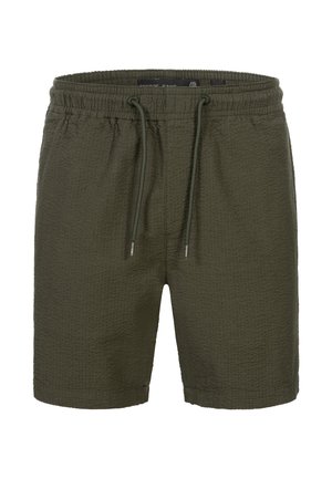 Pantalones cortos verde oliva con un tejido texturizado, cinturilla elástica y cierre de cordón. Presenta un corte relajado y sin bolsillos visibles.