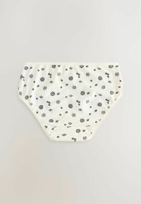 Mutande di cotone bianche decorate con piccoli motivi floreali e fogliari neri, con una vita elastica e un design a copertura totale.