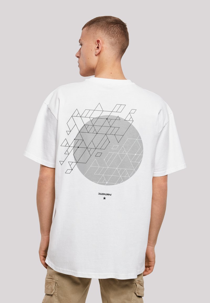 White cotton t-shirt featuring a large gray circle with geometric black line patterns on the back. Loose fit with short sleeves.