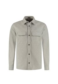 Lichtgrijze langemouwige overhemdjacket met knopen, voorzien van twee borstzakken met klep en een klassieke kraag.