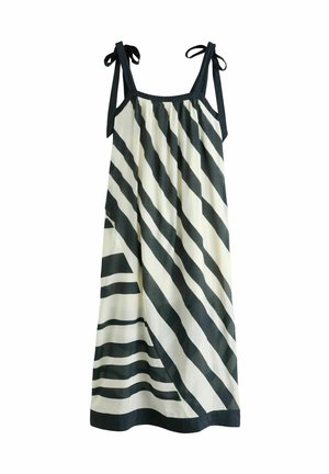 Striped dress with navy and cream colors, featuring diagonal stripes, shoulder ties, and a loose, flowing design. Soft fabric texture.