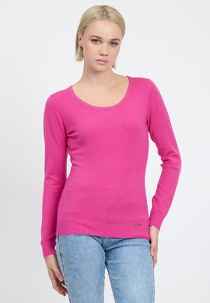 Maglione rosa a maniche lunghe con scollo rotondo e polsini e orlo a costine. Realizzato in materiale morbido, presenta un piccolo logo nella parte inferiore.
