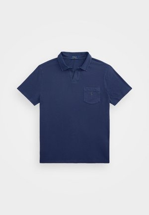 Polo azul-marinho com gola curta, um bolso no peito e um logótipo bordado. Feito de um tecido suave e texturado.