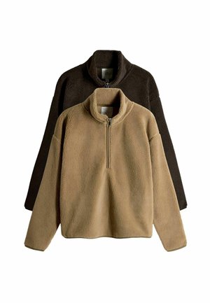 Fleece-Pullover in Beige und Dunkelbraun; verfügt über einen hohen Kragen und einen halben Reißverschluss auf der Vorderseite. Weiche Textur, lockere Passform und lange Ärmel.