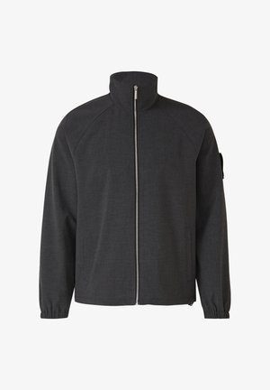 Dunkelgraue Jacke mit Reißverschluss, hohem Kragen, langen Ärmeln mit elastischen Bündchen, Fronttaschen und einer kleinen Aufsatztasche am linken Ärmel.