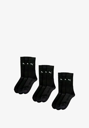 Black cotton socks with ribbed texture, featuring small white Puma logos at the top. Set includes six pairs, all in the same color.