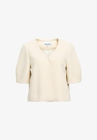 Top de mangas cortas color crema con diseño de escote en V, que presenta una silueta limpia y una tela suave, sin cierres visibles.