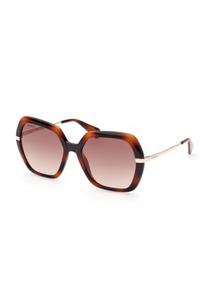 Occhiali da sole oversize con motivo tartarugato, lenti sfumate, una spessa montatura superiore e aste metalliche sottili. Accenti traslucidi in marrone scuro e oro.