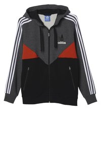 Sudadera con cremallera de Adidas que presenta secciones en gris, negro y rojo, con franjas blancas en las mangas y bolsillos con cremallera en la parte frontal, fabricada en una tela suave.