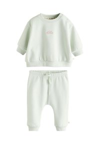 Ensemble assorti vert clair pour enfants, comprenant un sweat-shirt à manches courtes avec texte brodé et un pantalon à taille élastique avec cordon de serrage.
