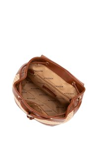 Sac à main en cuir marron avec des accents tissés. L'intérieur présente une doublure beige et une poche zippée, estampillée "WITTCHEN". Forme courbée, design ouvert.