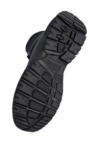 Black rugged boot sole with deep treads and the word "MAGNUM" embossed for enhanced grip and durability.