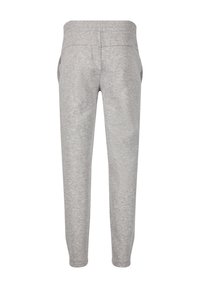 Graue Jogginghose aus weichem Material, mit elastischem Bund, schmal zulaufenden Beinen und Seitentaschen. Schlichtes und funktionales Design.