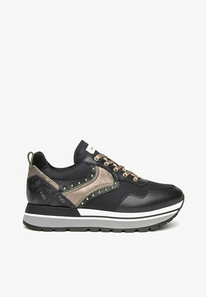 Black athletic sneakers with mesh and leather upper, khaki accents, round toe, decorative studs, grey sole with white stripes, and lace closure.