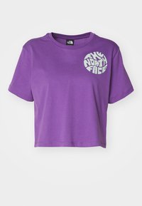 Purple cropped t-shirt made of soft fabric, featuring a circular white logo on the left chest area and short sleeves.