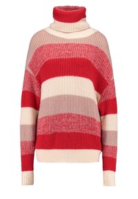 Pull à col roulé à rayures rouges et crème, coupe ample, présentant des bandes de textures côtelées douces de largeurs variées dans des nuances de rouge et de rose.