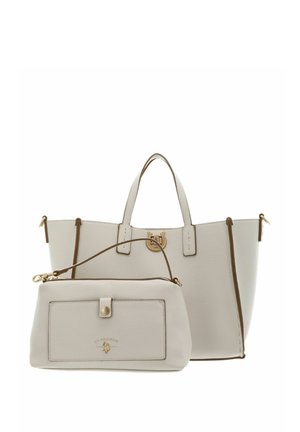 Witte leren totebag met dubbele hengsels en bijpassend afneembaar polstasje, met goudkleurige hardware en U.S. Polo Assn. logo.