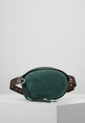 Dark green suede oval belt bag with brown leather adjustable strap and silver zipper pull on white surface.