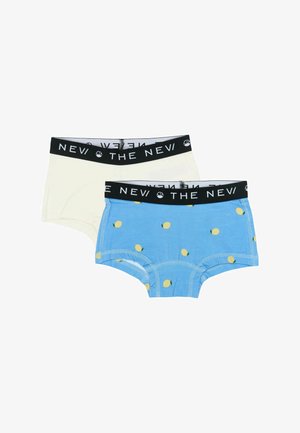 Sada bavlněného spodního prádla zahrnující jeden krémový a jeden modrý pár s žlutým potiskem citronu. Oba mají černý elastický pás s textem.