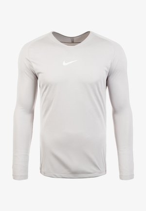 Camiseta deportiva de manga larga de color gris claro con cuello redondo y logo blanco de Nike Swoosh centrado en el pecho.