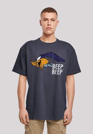 Navy blue oversized t-shirt made of cotton, featuring a cartoon character graphic in yellow and blue with the text "BEEP BEEP" in gray.