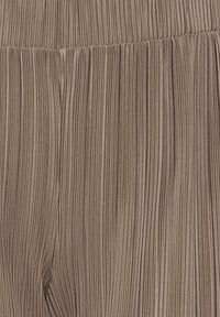 Taupe fabric with fine vertical pleats and a seam running horizontally across the middle, creating gathered texture.