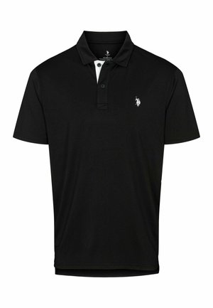 Črna polo majica iz mehke tkanine. Ima ovratnik, trirazpored z gumbi in majhen bel logotip na levi strani prsnega dela.