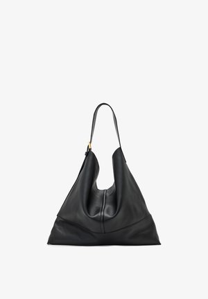 Sort læderhåndtaske med et unikt, asymmetrisk design. Har en enkelt, justerbar skulderrem og en glat tekstur.