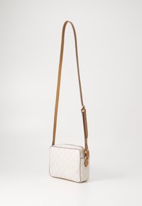 Small rectangular crossbody bag in white checkered canvas, featuring a light brown leather strap and golden hardware accents.