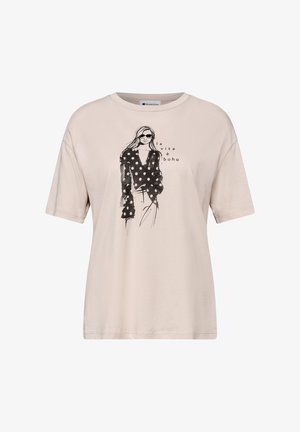 Beige t-shirt med sort skitse af en kvinde iført prikket top og solbriller, med teksten "la vita è boho" på fronten.