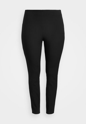 Black, high-waisted leggings made of stretch fabric. Fitted design with a smooth texture and no visible seams or pockets.