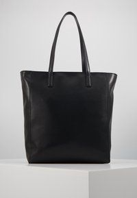 Black leather tote bag with two sturdy handles, rectangular shape, smooth texture, and minimalistic design. No visible hardware or patterns.