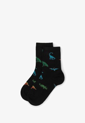 Sorte sokker med forskellige farverige dinosaurdesigns i blå, grøn og rød. Lavet af et blødt, fleksibelt stof. Ankellængde.
