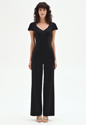 CON MANICHE CORTE - Combinaison - black